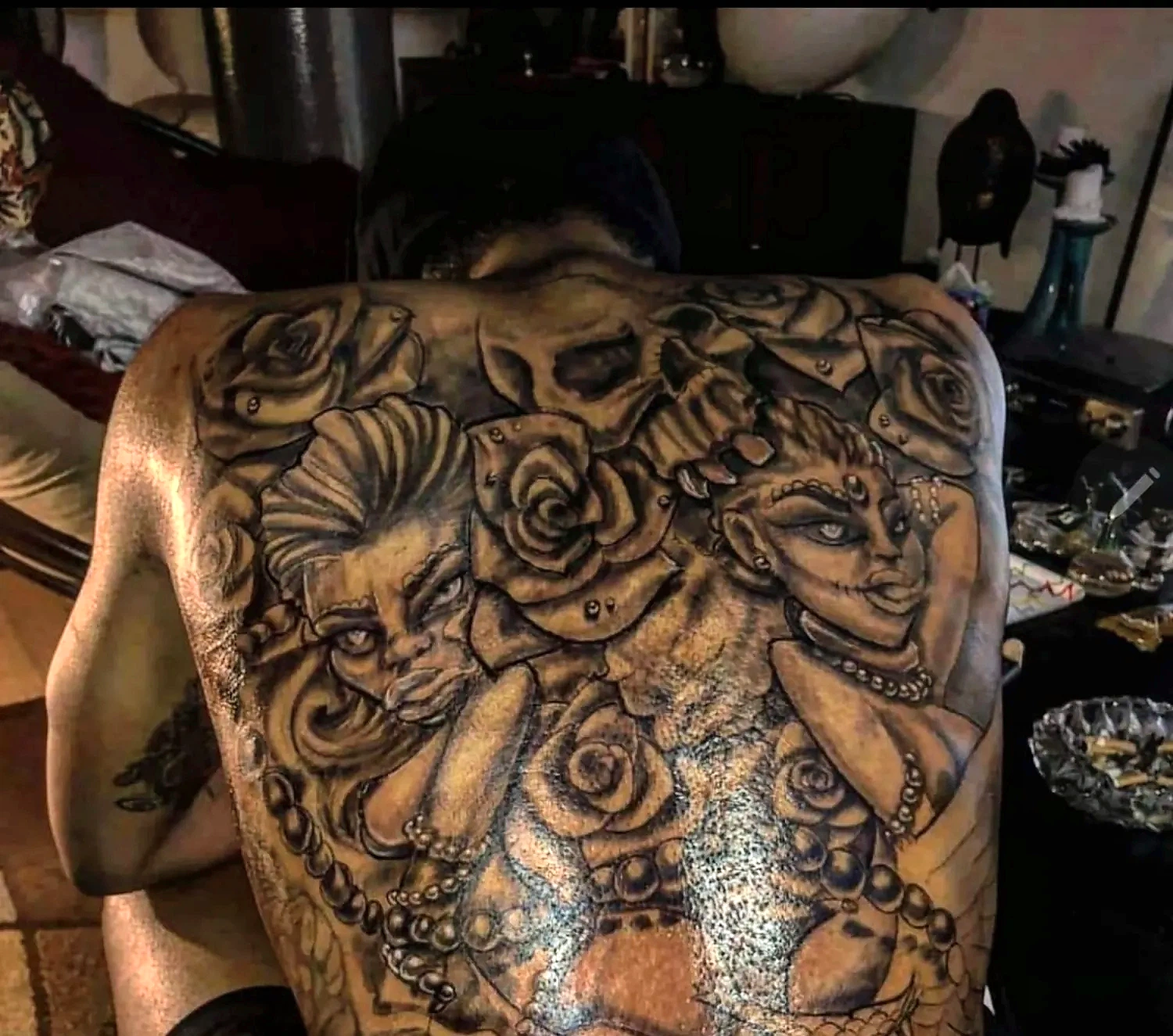 Large illustrative back tattoo by Krayonz